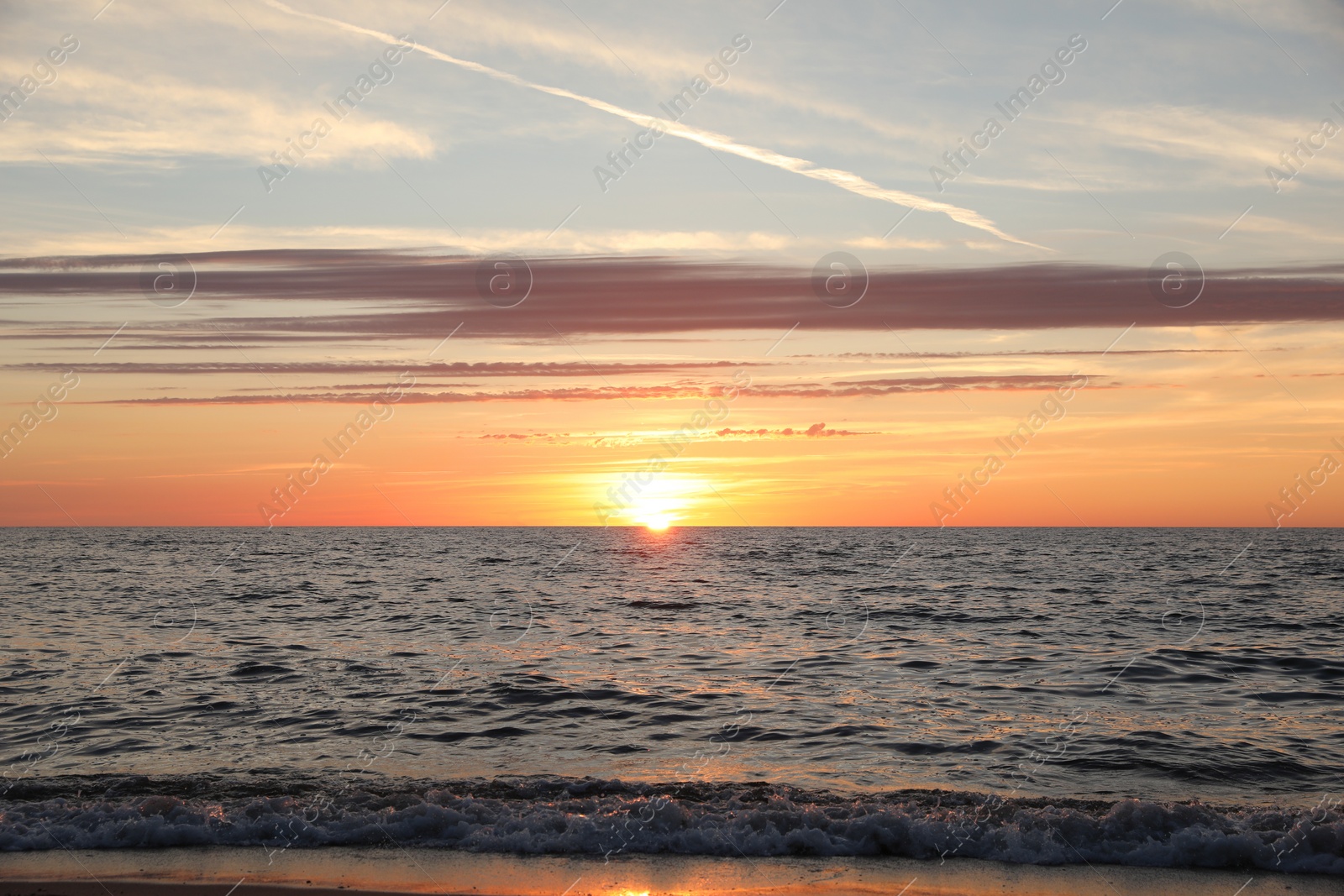 Photo of Picturesque view of sea at sunset. Tropical beach