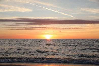 Photo of Picturesque view of sea at sunset. Tropical beach