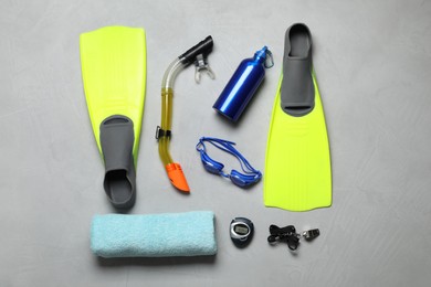 Photo of Flat lay composition with sports equipment on grey background