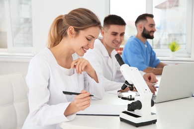 Photo of Medical students working in modern scientific laboratory