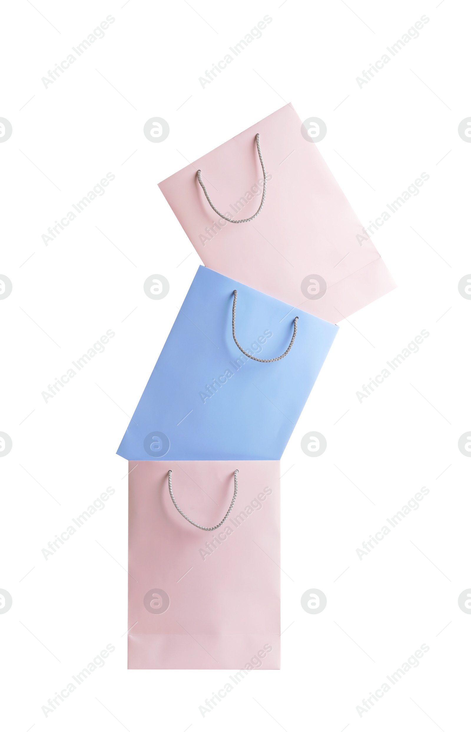 Photo of Colorful paper shopping bags on white background