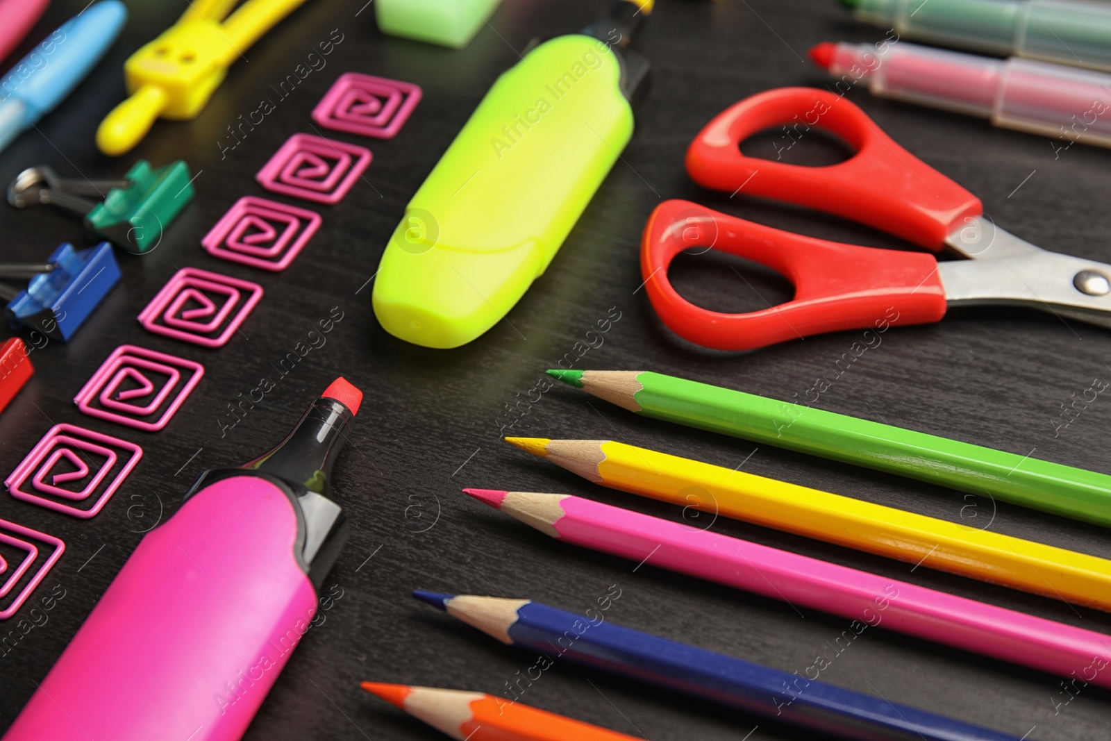 Photo of Different stationery on wooden table. Back to school