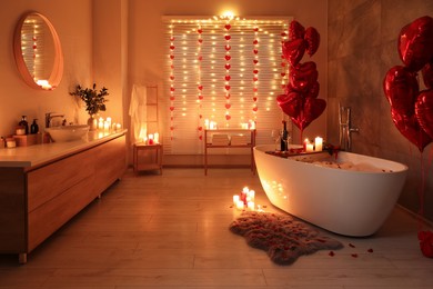 Photo of Stylish bathroom decorated for Valentine's day. Interior design