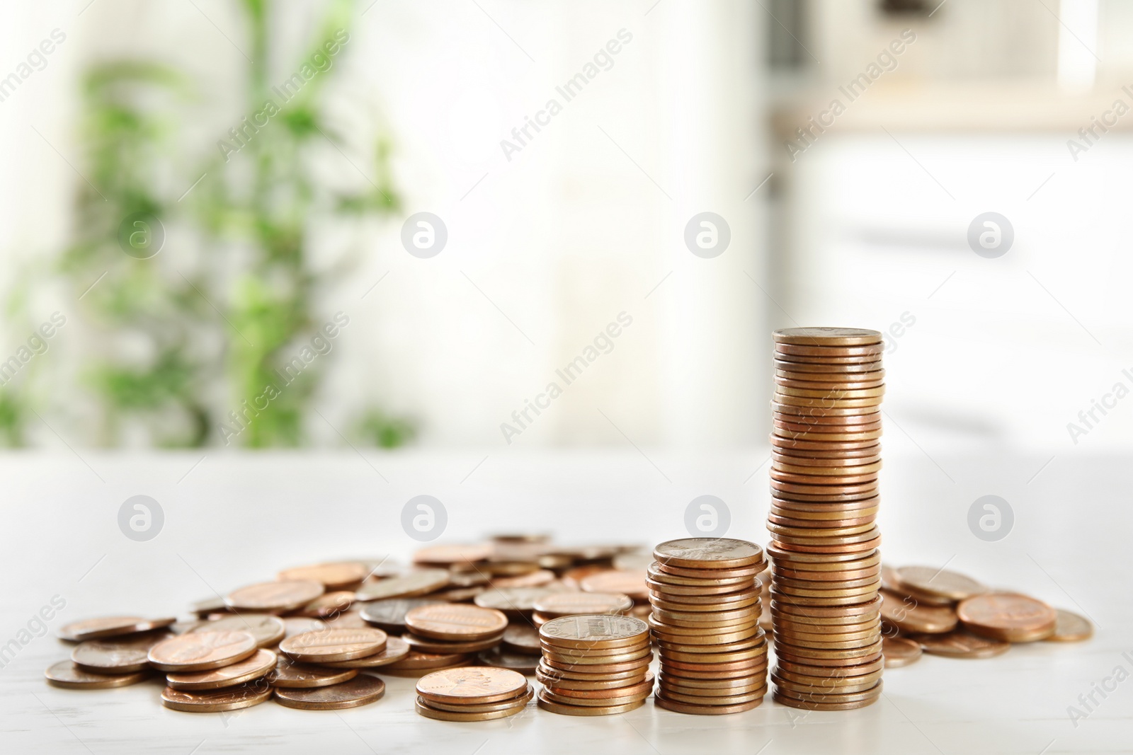 Photo of Many coins on white table, space for text. PENSION fund