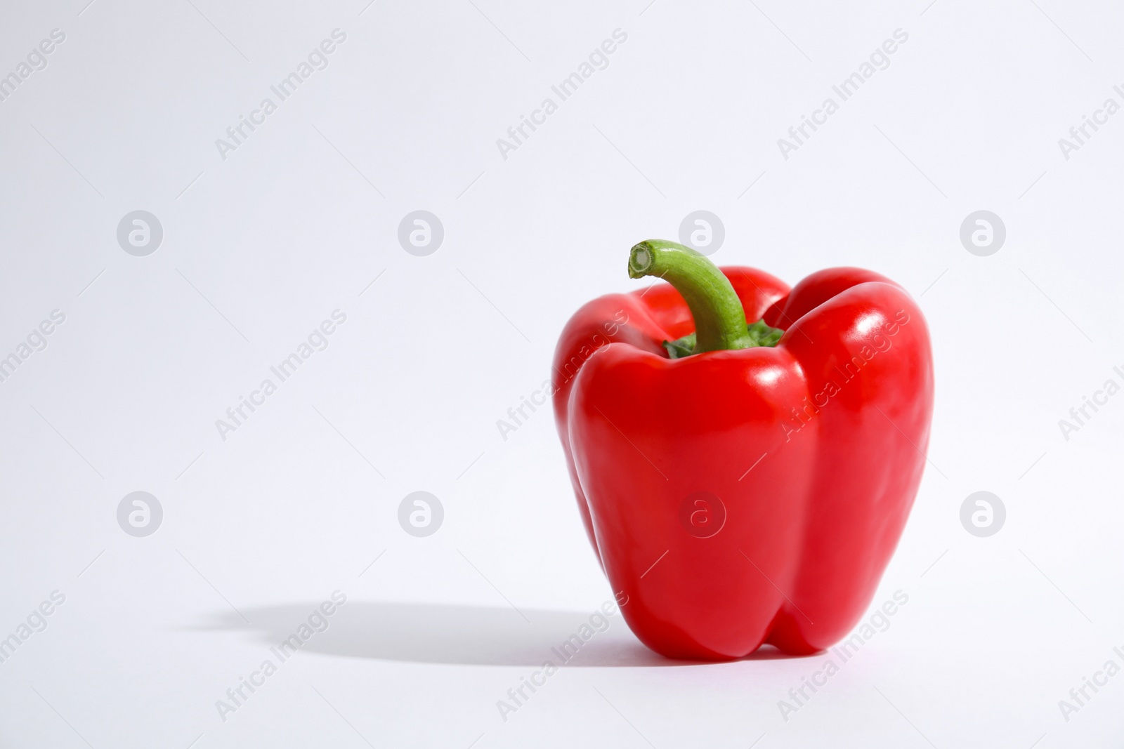 Photo of Raw ripe paprika pepper on white background