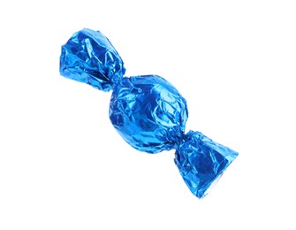 Photo of Tasty candy in blue wrapper isolated on white