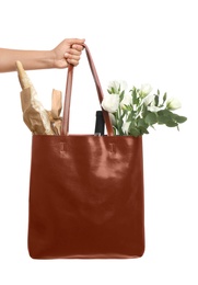 Photo of Woman holding leather shopper bag on white background, closeup