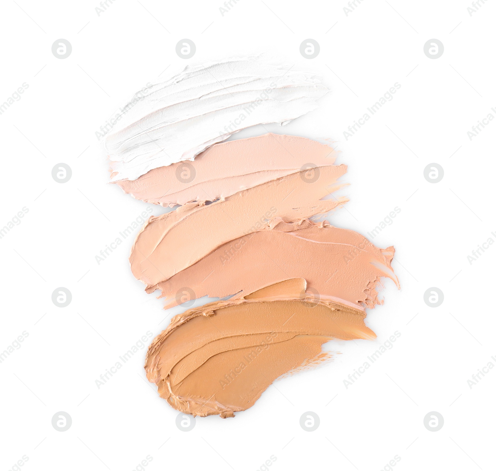 Photo of Different shades of foundation on white background. Professional makeup products