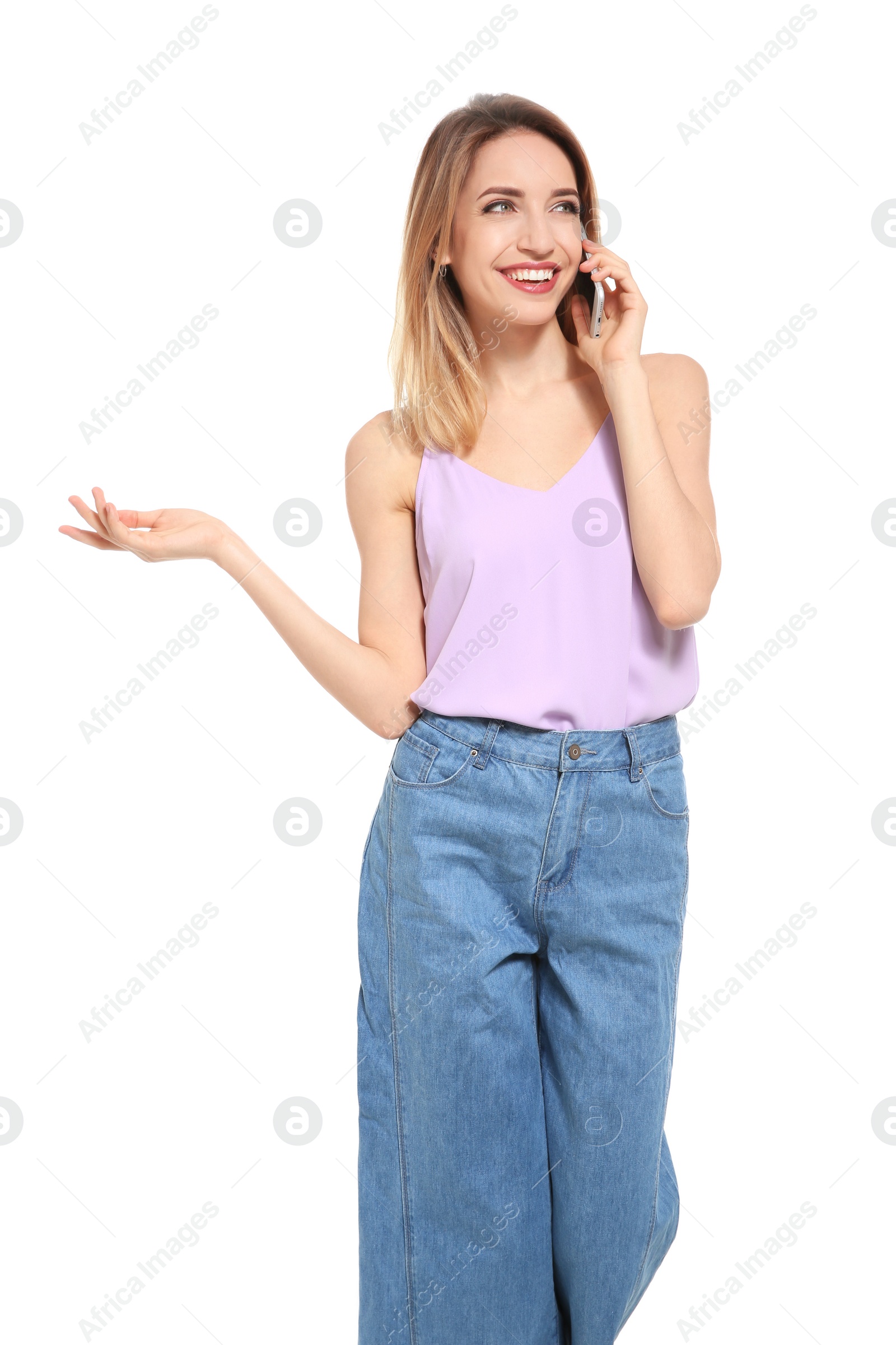 Photo of Young woman talking on phone against white background