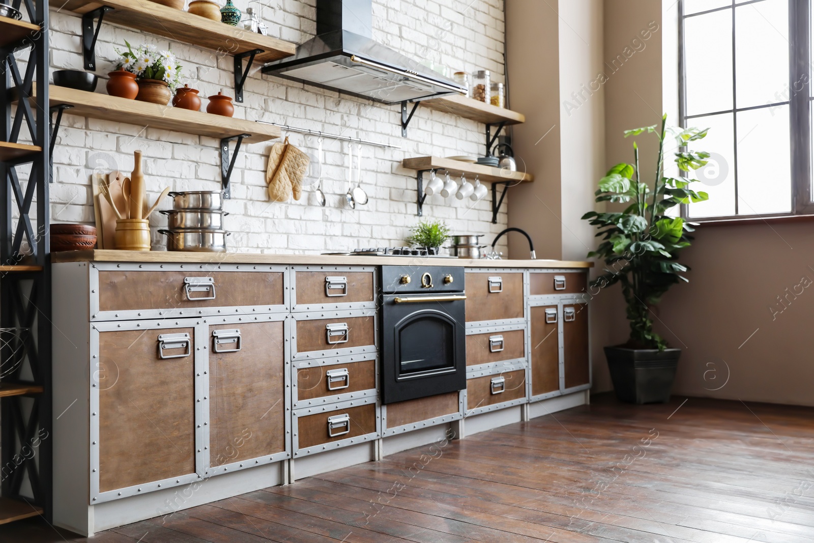 Photo of New modern oven in stylish kitchen. Cooking appliance