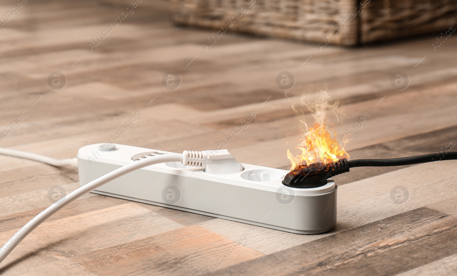 Image of Inflamed plug in power board - result of electrical short circuit