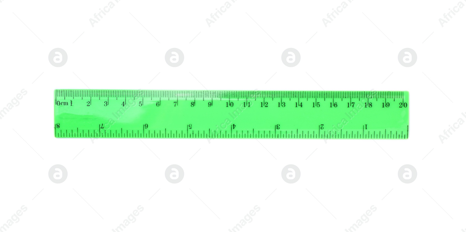 Photo of Colorful plastic ruler on white background. School stationery