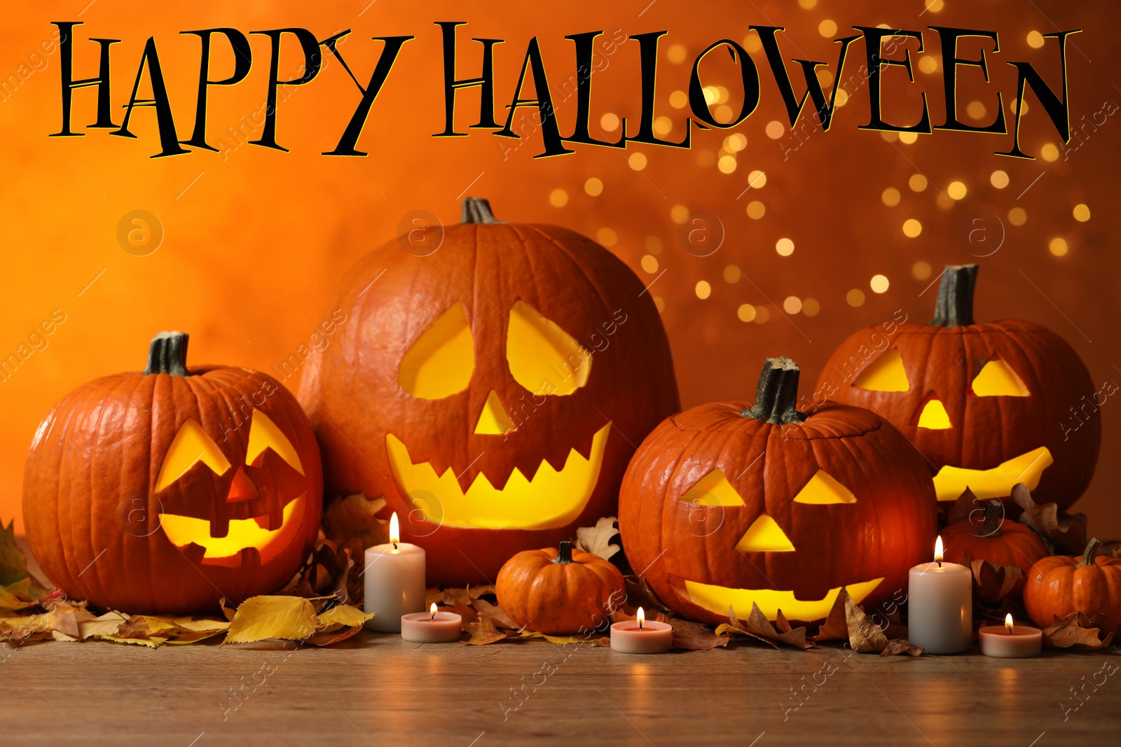 Image of Happy Halloween. Jack o'lanterns, autumn leaves and candles on table against orange background with blurred lights