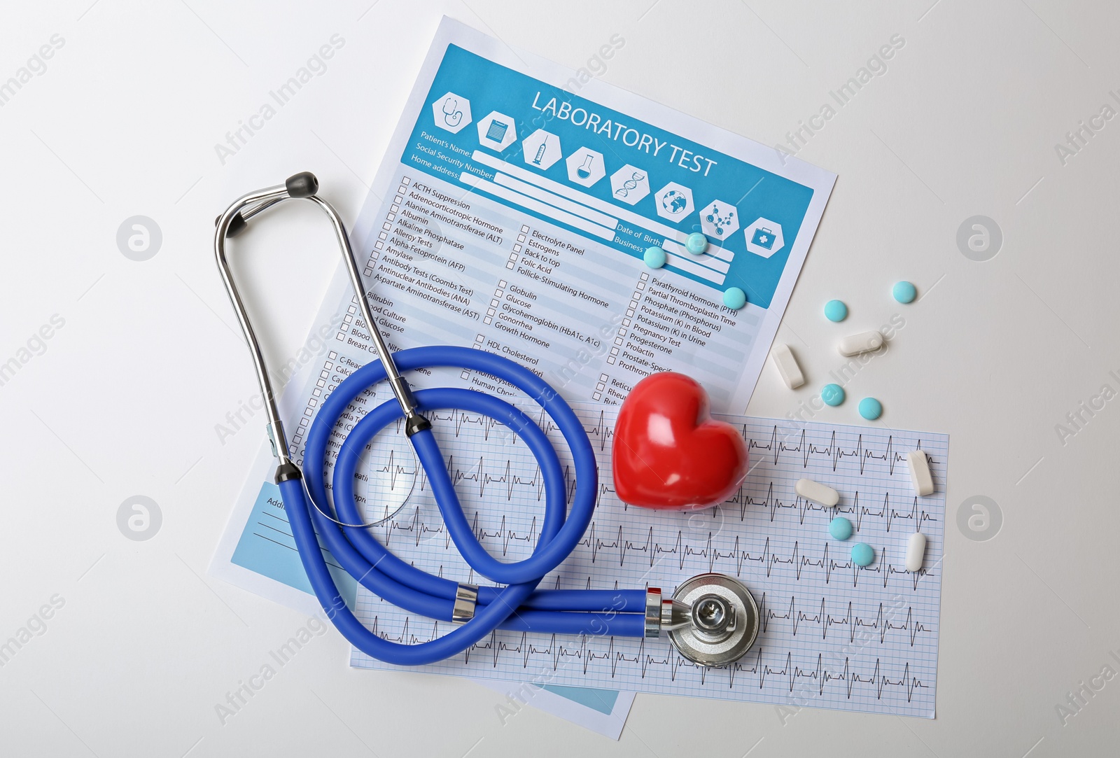 Photo of Composition with stethoscope and pills on white background. Cardiology service