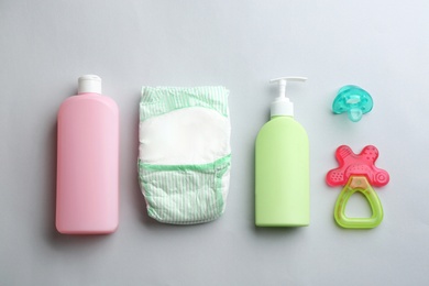 Photo of Flat lay composition with baby accessories on light background