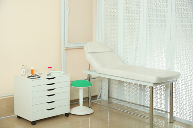 Photo of Modern interior of doctor's office with couch