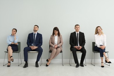 People waiting for job interview in office hall