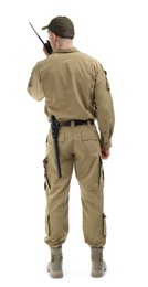 Male security guard using portable radio transmitter on white background