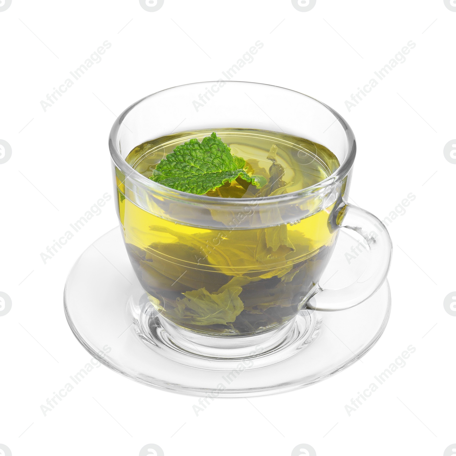 Photo of Fresh green tea in glass cup, mint and saucer isolated on white