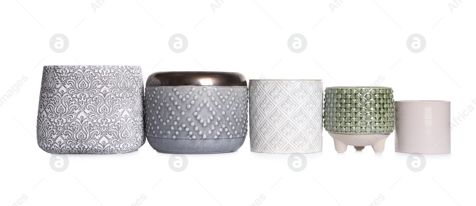 Photo of Different stylish ceramic flowerpots on white background