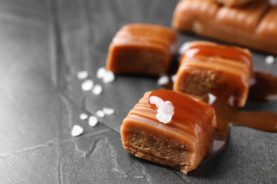 Salted caramel on grey table, closeup view