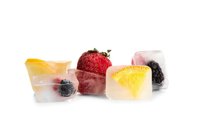 Ice cubes with berries and oranges on white background