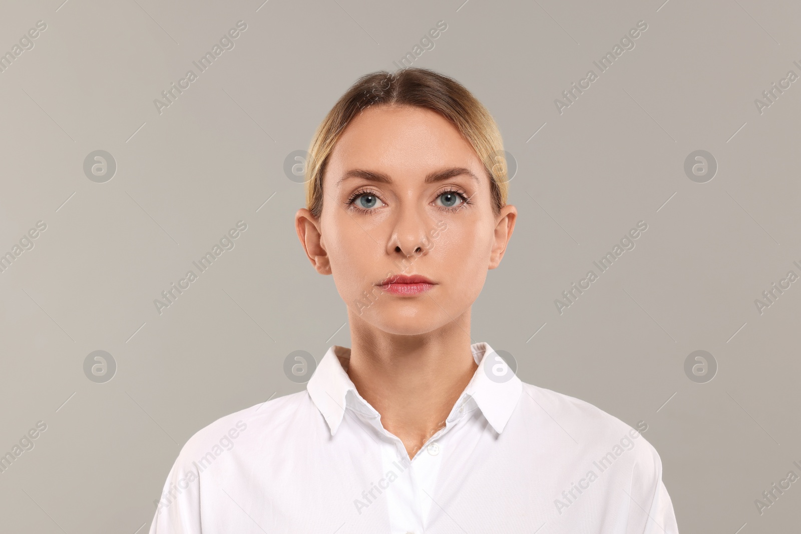 Photo of Portrait of beautiful woman on light grey background