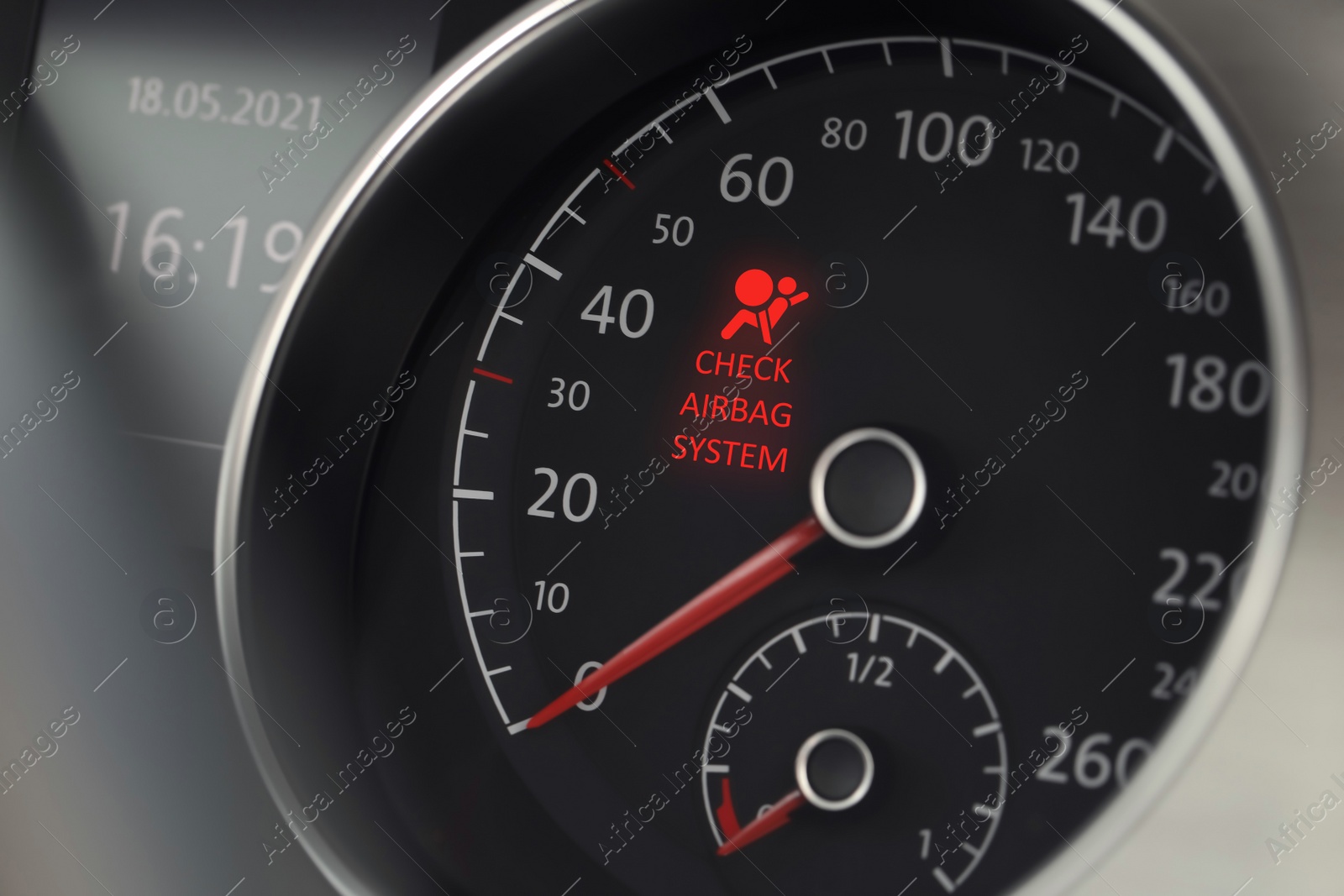 Image of Closeup view of dashboard with warning icon check airbag system in car