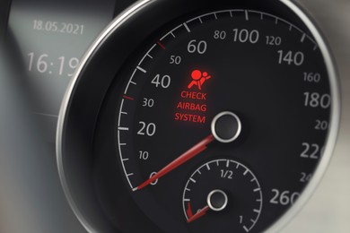 Image of Closeup view of dashboard with warning icon check airbag system in car