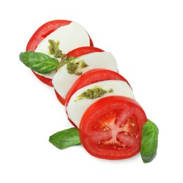 Photo of Tasty salad Caprese with mozzarella, tomatoes, basil and pesto sauce isolated on white, top view