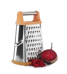 Photo of Stainless steel grater and fresh beetroot on white background