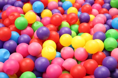 Many colorful balls as background, closeup. Kid's playroom