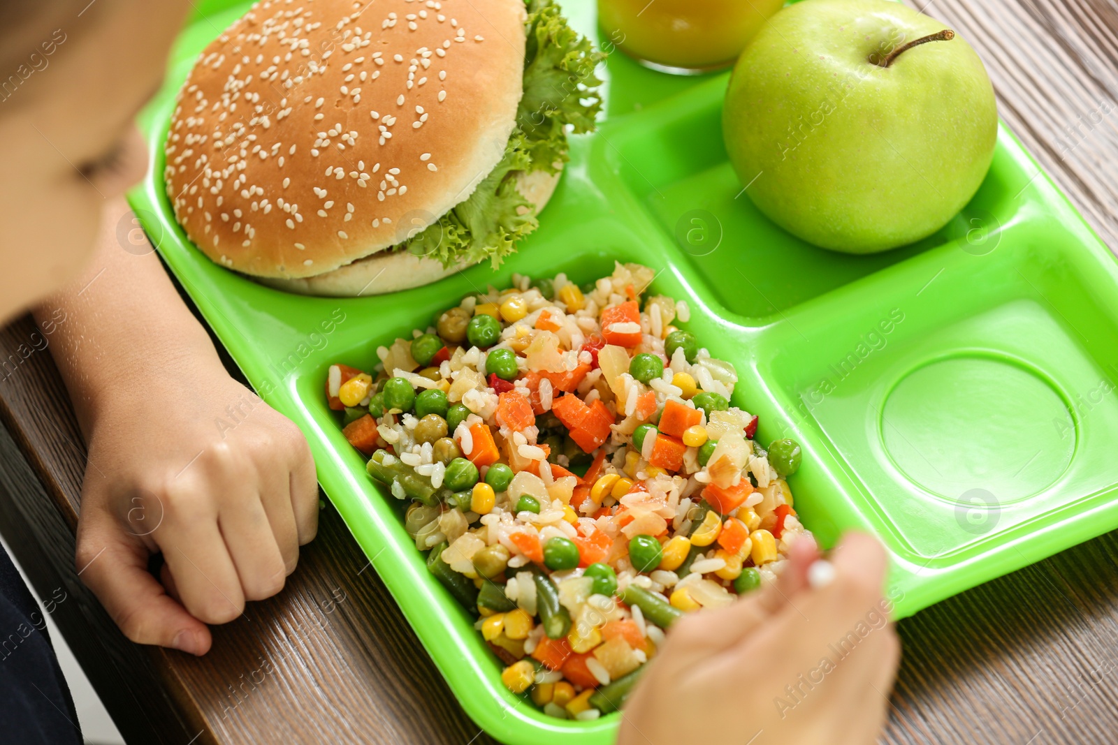 Photo of Child with healthy food for school lunch at desk, closeup