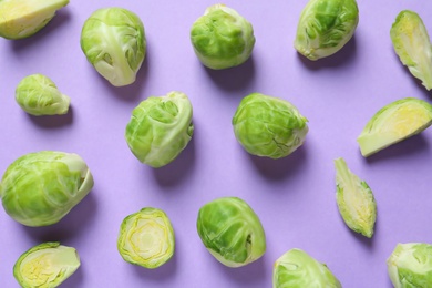 Fresh Brussels sprouts on color background, flat lay