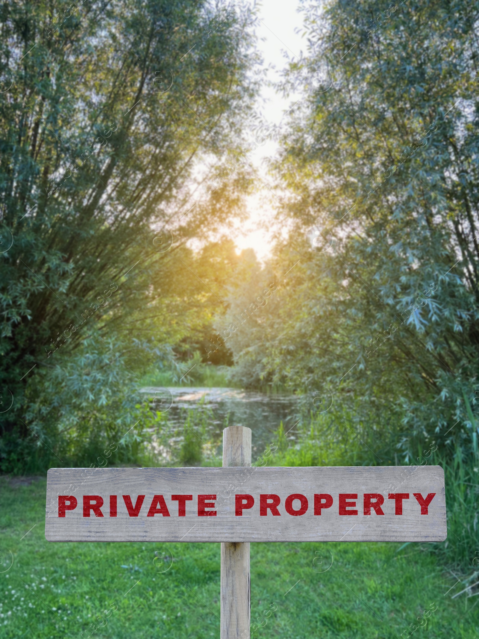 Image of Wooden sign with text Private Property near lake