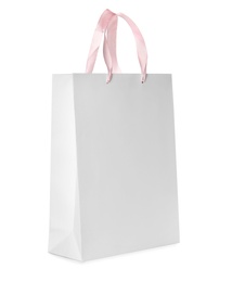 Photo of Paper shopping bag isolated on white. Mock up for design