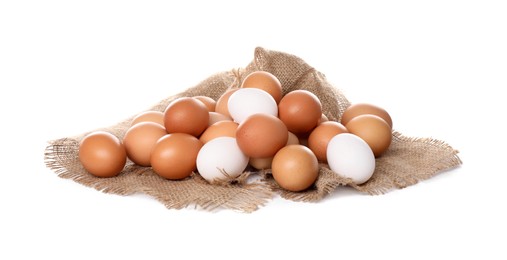 Photo of Fresh chicken eggs and burlap fabric isolated on white