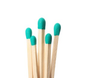 Photo of Matches with turquoise heads on white background