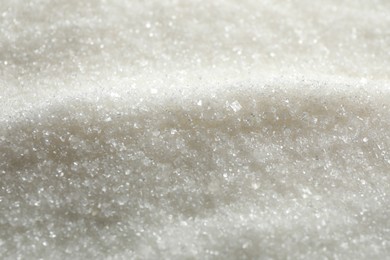 Photo of Pile of granulated sugar as background, closeup