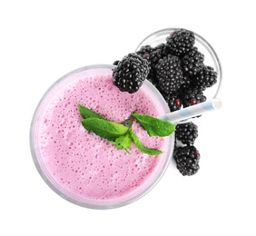 Photo of Tasty blackberry milk shake with fresh berries and mint isolated on white, top view