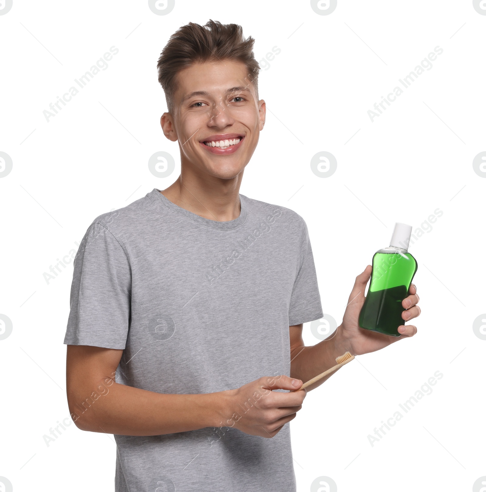 Photo of Young man with mouthwash on white background