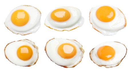 Set with tasty fried eggs on white background