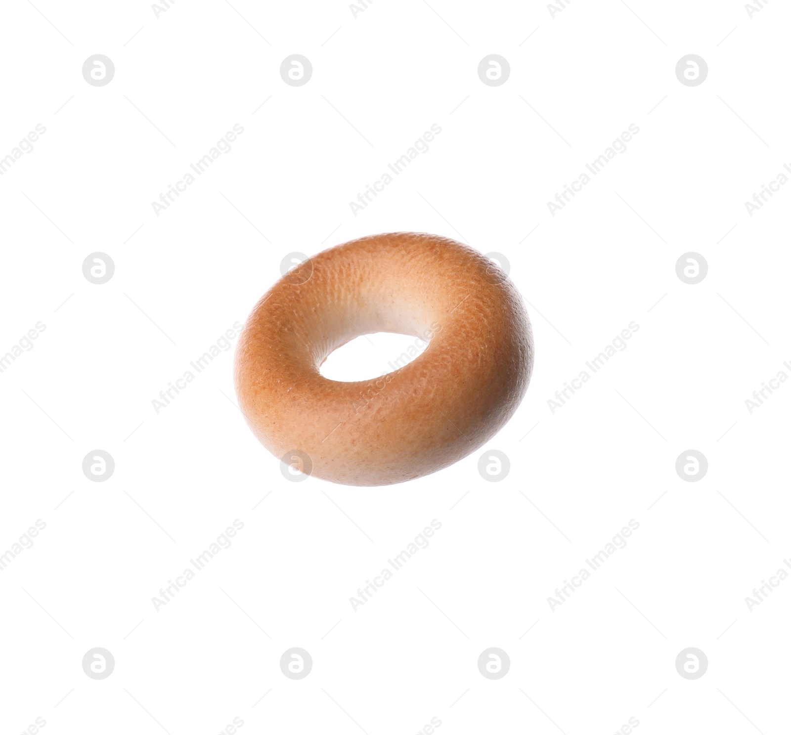 Photo of One tasty dry bagel (sushka) isolated on white