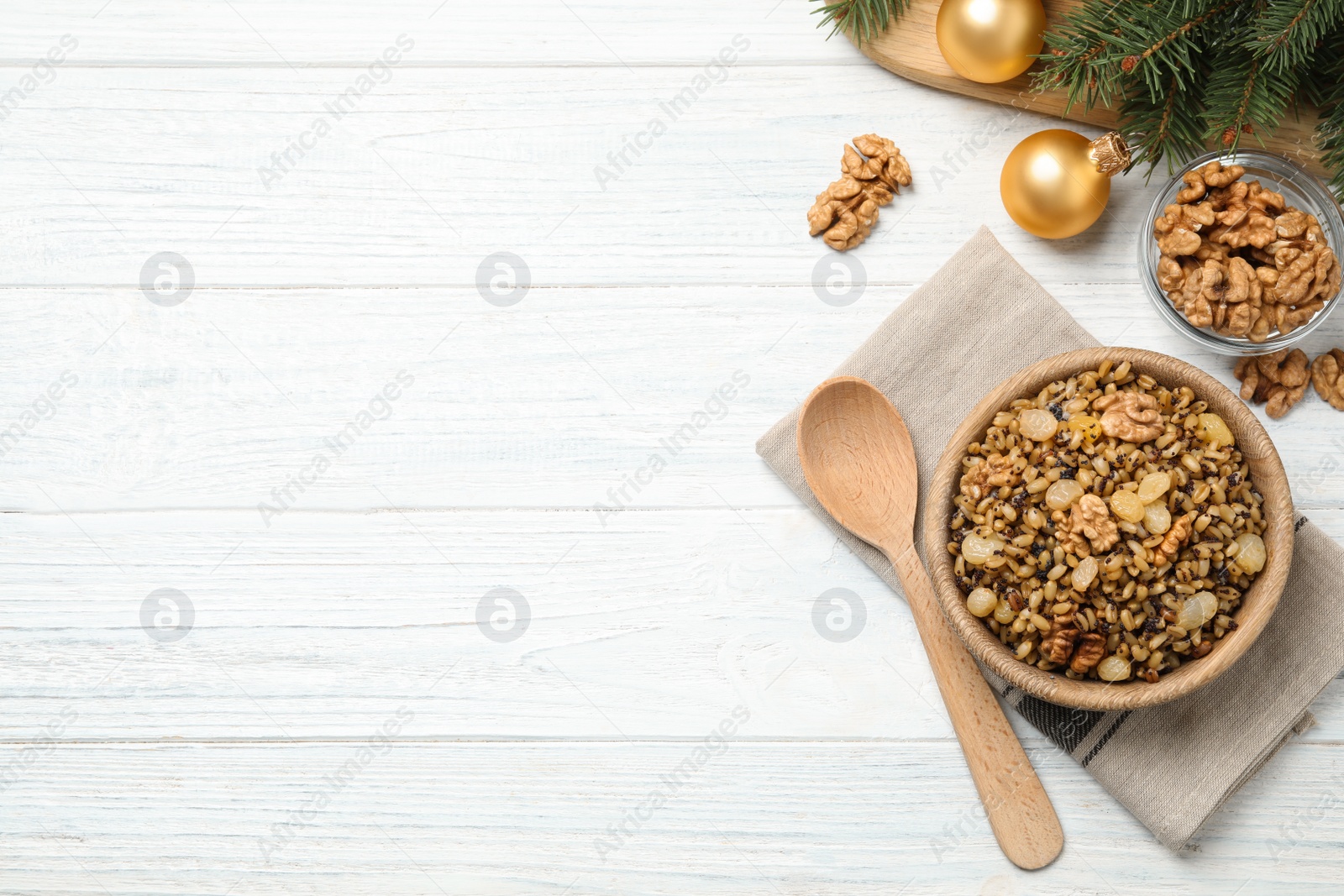 Photo of Traditional Christmas slavic dish kutia served on white wooden table, flat lay. Space for text