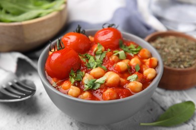 Photo of Delicious chickpea curry in bowl on table, closeup