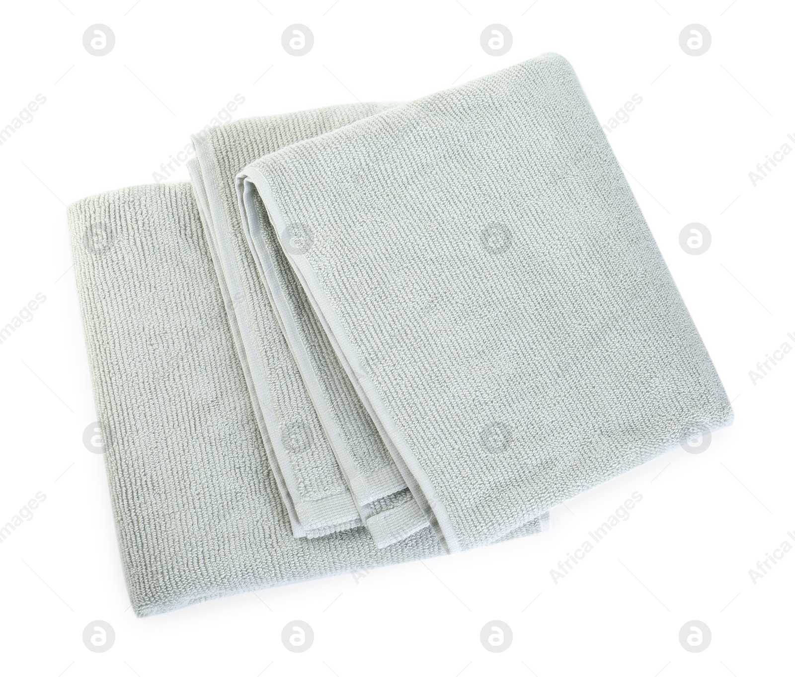 Photo of Soft folded towels isolated on white, top view