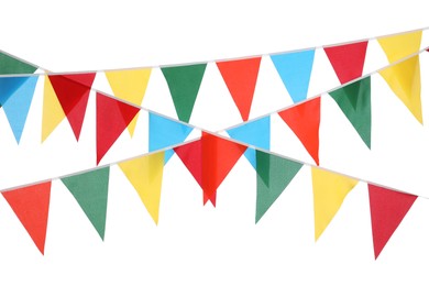 Photo of Buntings with colorful triangular flags on white background. Festive decor