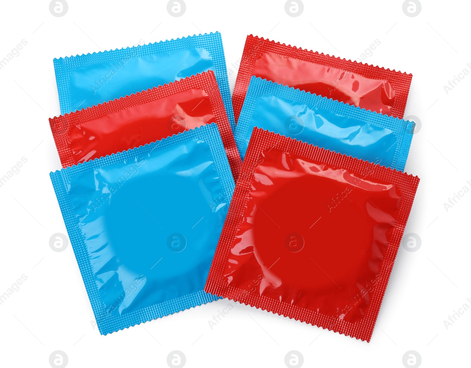 Photo of Condom packages isolated on white, top view. Safe sex