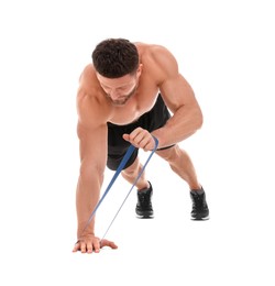 Young man exercising with elastic resistance band on white background