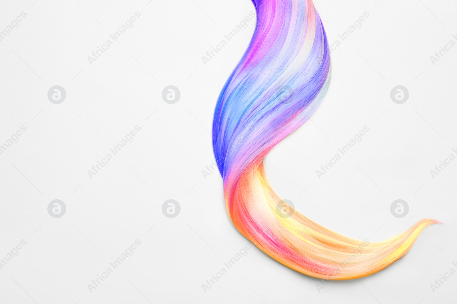 Image of Strand of beautiful multicolored hair on white background, top view